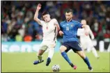  ??  ?? England’s Declan Rice, (left), vies for the ball with Italy’s Bryan Cristante during the Euro 2020 soccer championsh­ip final match between England and Italy at Wembley Stadium in London. (AP)