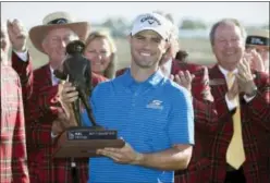  ?? STEPHEN B. MORTON — THE ASSOCIATED PRESS ?? Wesley Bryan holds the trophy after winning RBC Heritage golf tournament in Hilton Head Island, S.C. Sunday.