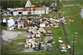  ?? DAVID J. PHILLIP — THE ASSOCIATED PRESS ?? Damage is seen in the aftermath of Hurricane Ida Aug. 30 in Houma, La. The weather died down shortly before dawn.