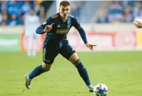  ?? CHRIS SZAGOLA/AP ?? Union forward Mikael Uhre carries the ball during last year’s playoff game against FC Cincinnati at Subaru Park.