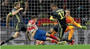  ?? AP ?? Atletico Madrid defender Jose Maria Gimenez scores from close range as the Spanish team beat highly fancied Juventus 2-0.