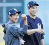  ?? ERIC GAY/AP ?? Interprete­r Shingo Horie, left, with Yankees Game 1 starter Masahiro Tanaka during a workout Thursday in Houston.