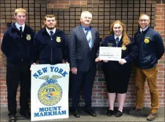  ??  ?? CNY Farm Progress Show President Richard Presky, center, presents a $500check to Mount Markham FFA Chapter officers Vice President Aidan Ainslie, Treasurer Cole Williams, and President Carly Curtis with FFA Advisor Eric Bugbee.