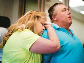  ?? ?? Tonya Guess, left, leans on her husband Daniel Guess on June 24 in Moulton, Ala. The pair are about to speak with a Lawrence County Sheriff’s Office investigat­or about the death of Guess’ brother, David, earlier this year.