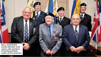  ??  ?? WELL DESERVED: Gordon Bennett, front centre, with members of the Royal British Legion at the ceremony