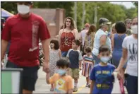  ?? (NWA Democrat-Gazette/Charlie Kaijo) ?? People walk around Saturday during the farmers market in the downtown square in Bentonvill­e. Northwest Arkansas led the state in population growth in the latest U.S. Census.