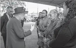  ?? AFP ?? Queen Elizabeth II meets members of the community affected by the fire at Grenfell Tower during a visit to the Westway Sports Centre on Friday.