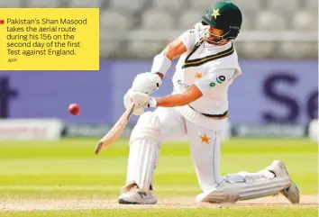  ?? AFP ?? Pakistan’s Shan Masood takes the aerial route during his 156 on the second day of the first Test against England.