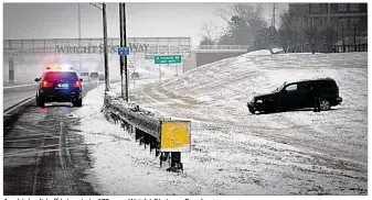  ?? PHOTOS BY MARSHALL GORBY / STAFF ?? A vehicle slid off Interstate 675 near Wright State on Sunday.