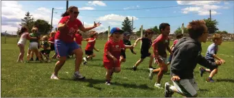  ??  ?? Kids at Active Kingdom camp running from Linda.