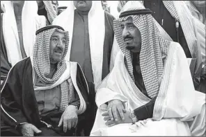  ?? AP ?? Saudi Arabia’s new King Salman (right) talks with Kuwaiti Emir Sheikh Sabah Al-Ahmad Al-Jaber Al-Sabah during Friday’s funeral service for King Abdullah at the Imam Turki bin Abdullah mosque in Riyadh.