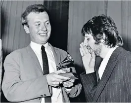  ??  ?? Ringo Starr jokes with Emerick as he presents him with a Grammy for Sgt Pepper; below, Revolver