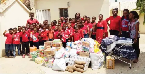  ??  ?? Pupils of Goshen Internatio­nal Academy, Gwarinpa, donate relief items to Mother Theresa Orphanage as part of activities to celebrate Valentine' s Day yesterday