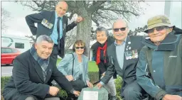  ?? PHOTO: CLINTON LLEWELLYN ?? From left: Brothers Andrew and Wayne Williams, Ngaire Newland (nee Ellwood), Jill McLean, Grant Williams and Jim Ellwood next to the plaque unveiled at CHB College on Friday honouring Williams and gunner Stuart Ellwood, also killed in action in Vietnam.