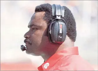  ?? UNLV PHOTO ?? Nunnely watches from the sideline in this undated photo. In 1988, Nunnely and Ohio’s Cleve Bryant became the first Black head coaches to face each other in a Division I football game. UNLV beat Ohio University, 26-18.