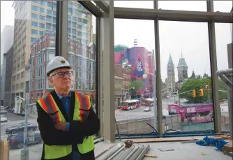  ?? Canadian Press photo ?? Architect Donald Schmitt surveys the new wing of the called the lantern, part of the new glass facade of the National Arts Centre as constructi­on continues at the National Arts Centre, in Ottawa last week.