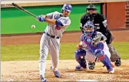  ?? AP PHOTO BY CHARLES REX ARBOGAST ?? Los Angeles Dodgers' Andre Ethier (16) hits a single during the sixth inning of Game 3 of baseball's National League Championsh­ip Series against the Chicago Cubs, Tuesday in Chicago.