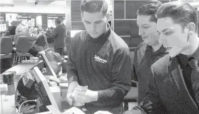  ?? WAYNE PARRY/AP ?? Employees working at the sports book in the Tropicana casino in Atlantic City, New Jersey, count money moments before it opened. Gambling companies across the nation are increasing­ly bringing different forms of gambling together.