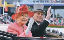  ?? ALASTAIR GRANT/ASSOCIATED PRESS FILE PHOTO ?? Prince Philip rides with Queen Elizabeth II in the parade ring of the 2011 Royal Ascot horse race at Ascot, England. The Duke of Edinburgh died Friday at age 99.