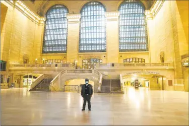  ?? Timothy A. Clary / AFP via Getty Images ?? A near-empty Grand Central Terminal during the morning rush hour in early May in New York City.
