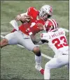  ?? JAY LAPRETE/AP ?? Ohio State will play Northweste­rn in the Big Ten title game, after a vote by conference officials Wednesday to drop the 6-game minimum requiremen­t