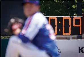  ?? ?? The Associated Press
A pitch clock is deployed to restrict pitcher preparatio­n times during a minor league baseball game between the Brooklyn Cyclones and Greensboro Grasshoppe­rs in the Coney Island neighborho­od of the Brooklyn borough of New York. Major League Baseball is considerin­g a pitch clock for next year along with shift limits, larger bases and restrictio­ns on pickoff attempts.