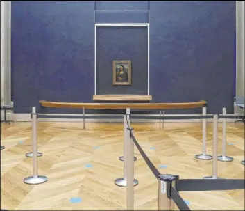  ?? Thibault Camus The Associated Press ?? Leonardo da Vinci’s “Mona Lisa” hangs Thursday in a deserted Louvre museum, which has seen no visitors for almost four months. It’s uncertain when the Paris museum will reopen, after being closed on Oct. 30.