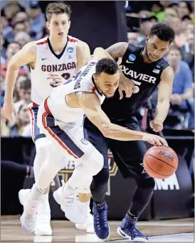  ?? Ben Margot / The Associated Press ?? Gonzaga’s Nigel Williams-Goss (left) strips the ball from Xavier’sTrevon Bluiett during the second half of Saturday’s regional final game in San Jose, Calif.