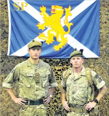  ?? PHOTO: CHRISTINE O’CONNOR ?? Geared up . . . Members of the Highlander­s 4th Battalion, The Royal Regiment of Scotland Captain M. L. Rupasinha (left) and Corporal M. Rumble say they are ready for the Twin Peaks challenge in Dunedin today.