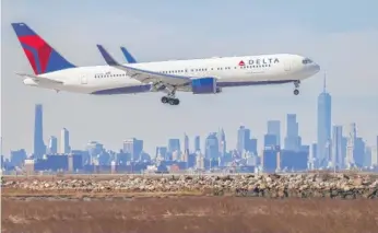  ?? CHARLY TRIBALLEAU/AFP VIA GETTY IMAGES ?? Delta Air Lines just reported its highest first-quarter revenue ever.