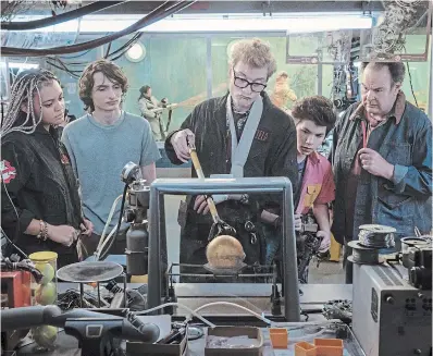  ?? ?? Celeste O’Connor, Finn Wolfhard, James Acaster, Logan Kim and Dan Aykroyd work together against spectral forces in “Ghostbuste­rs: Frozen Empire.”