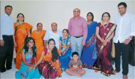  ??  ?? A SERIAL WINNER: Businessma­n J. Bhaskar Rao (fourth from left) with his family. He owns 15 different ventures in the city.