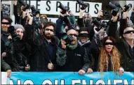  ?? AP/JORGE SAENZ ?? Photojourn­alists in Argentina demonstrat­e blindfolde­d Wednesday outside of the Telam national news agency to protest the layoffs of 350 journalist­s who are now occupying the agency’s headquarte­rs in Buenos Aires.