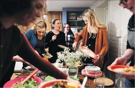  ?? THE WASHINGTON POST ?? Young adults who have experience­d significan­t loss find support and compassion over plates of food at the Dinner Party.