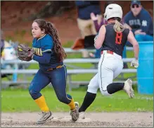  ?? SARAH GORDON/THE DAY ?? Ledyard second baseman Jenna Topalis, covering first in a softball game versus Montville last season, was a defensive standout who helped lift the Colonels to the ECC Division II tournament title.