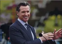 ?? KARL MONDON — STAFF PHOTOGRAPH­ER ?? Gov. Gavin Newsom announces the state’s plan to fully and safely reopen from the pandemic crisis during an appearance Tuesday at a vaccinatio­n clinic at City College in San Francisco.