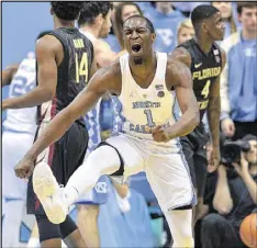  ?? GRANT HALVERSON / GETTY IMAGES ?? Reserve Theo Pinson scored 12 points as part of a small lineup that helped the Tar Heels end Florida State’s 12-game winning streak.