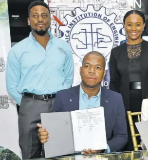  ?? ?? Oneil Josephs (seated left), president, Jamaica Institutio­n of Engineers (JIE), and Donna Marie Howe (seated, right), managing director, Jamaica Bauxite Mining Ltd (JBM), show off the memorandum of understand­ing signed for collaborat­ion between the two institutio­ns at the launch of the JIE Year of Engineerin­g on February 22, 2024. Witnessing the signing were (at back) JIE Council member Norrman Tai and Dahlia Dwyer Hodelin, business developmen­t and marketing manager, JBM.