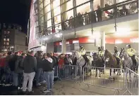  ??  ?? Cologne fans and police outside the stadium prior to the Europa League match against Arsenal at the Emirates Stadium, London yesterday. Extra police were sent to the stadium to deal with disorder after thousands of Cologne fans turned up ahead of the...