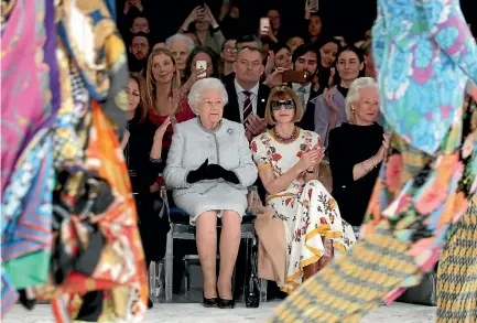  ?? PHOTO: GETTY IMAGES ?? The Queen sits with, from left, British Fashion Council chief executive Caroline Rush, Vogue edtor Anna Wintour, and royal dressmaker Angela Kelly as they view Richard Quinn’s runway show at London Fashion Week before presenting him with the inaugural...