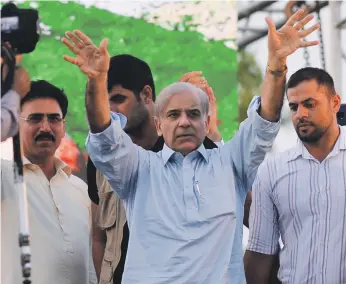  ?? AFP ?? Shehbaz Sharif, centre, greets party supporters before Pakistan’s general election in July. Next week’s by-elections could affect Prime Minister Imran Khan’s slim parliament­ary majority