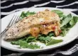  ?? DEB LINDSEY / WASHINGTON POST ?? A four-ingredient stuffing adds punchy antipasto flavors to Roasted Red Pepper Stuffed Chicken Breasts.