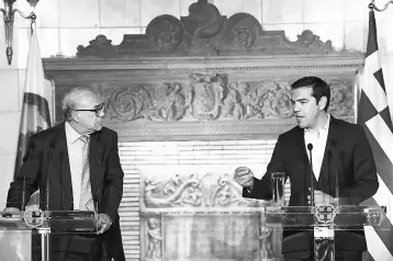  ??  ?? Greek Prime Minister Alexis Tsipras (right) and Organizati­on for Economic Co-operation and Developmen­t (OECD) Secretary General Angel Gurria (left) deliver a press conference after their metting in Athens on April 30. — AFP photo