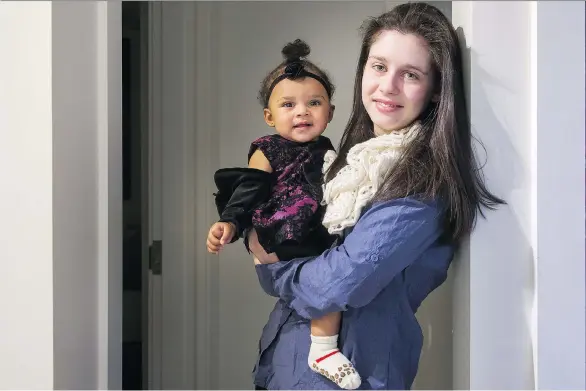  ?? PHOTOS: ARLEN REDEKOP ?? Amber Hawse, 20, says she wants her nine-month-old daughter Delilah to experience the financial and emotional stability she never had.