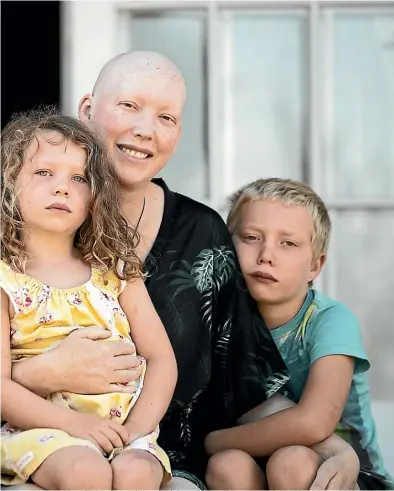  ?? CHRISTEL YARDLEY/STUFF ?? Above: Kristy Christense­n with her children, Zak and Lily, and husband Mark. Below, from left: Oncologist Melissa James, lung cancer specialist Dr George Laking and Lucy Elwood, chief executive of the NZ Cancer Society.