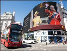  ??  ?? Images reflecting and celebratin­g the life of HRH Prince Philip are displayed on the large screen at Piccadilly Circus