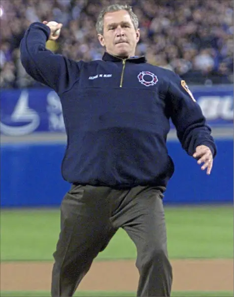  ?? Associated Press ?? President George W. Bush throws out the first pitch before Game 3 of the 2001 World Series, almost seven weeks after the Sept. 11 terrorist attacks.