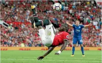  ?? PHOTO: REUTERS ?? Manchester United defender Eric Bailly clears acrobatica­lly as United made it three wins and three clean sheets out of three.