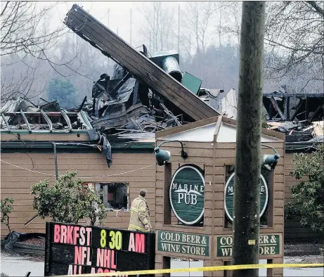  ??  ?? A three-alarm blaze at the Marine Pub & Brew House in Burnaby on Saturday destroyed virtually everything but three of the building’s exterior walls. The building is a total loss. No injuries were sustained.