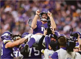  ?? Adam Bettcher / Getty Images ?? Greg Joseph of the Vikings celebrates after making a 29-yard field-goal try as time expired for a victory against the Packers, their division rival and longtime nemesis, in Minneapoli­s.